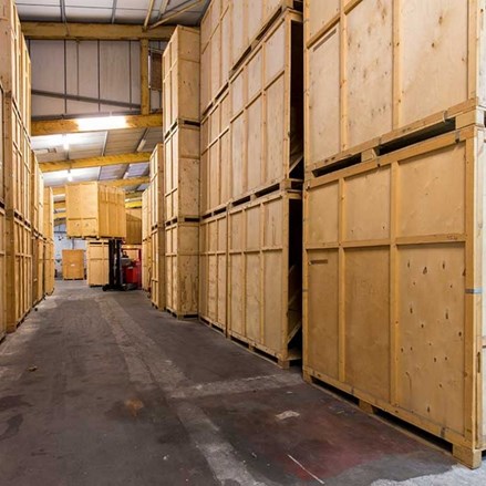 Wooden crates in a secure storage warehouse.