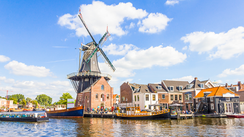 Windmill by a river in Haarlem, Netherlands