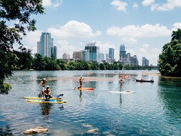 People paddleboarding on the river in Austin, Texas.