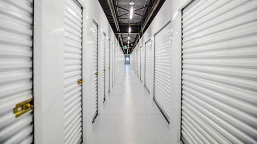 Corridor of white storage units