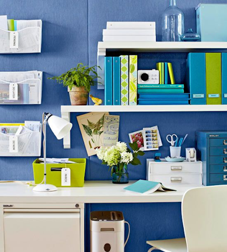 Bright and cheerful blue and green office decor scheme highly organised