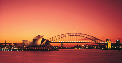Red-coloured sunset over Sydney harbour, with the iconic opera house