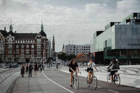 Cyclists crossing a bridge in Copenhagen, Denmark