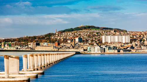 Tow Bridge leading to the city of Dundee with the ocean in front