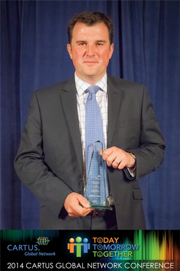 Neil Bishop with the Global Network Commitment to Excellence Gold Award